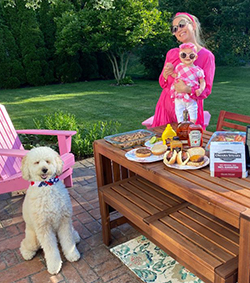 RSM professional and family enjoy a picnic of Omaha Steaks with dog