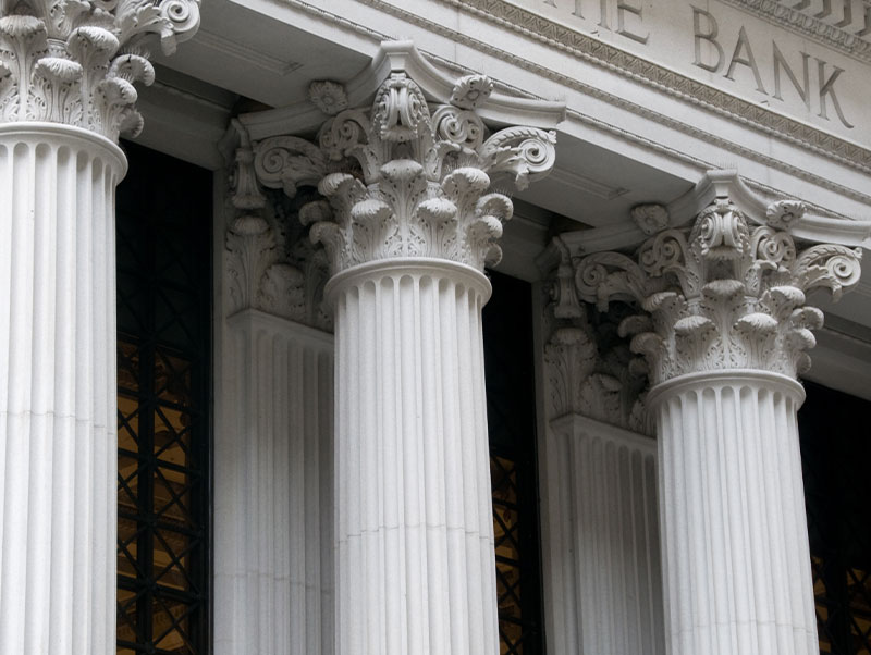 Exterior view of bank, columns standing strong